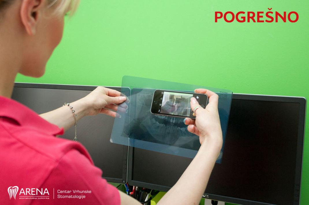 Pogrešno slikanje ortopana mobitelom koristeći monitor koji je taman.
